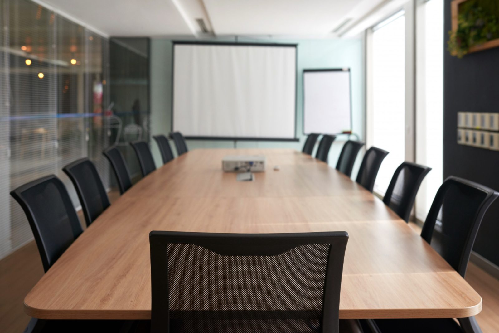 A boardroom table set for a morning meeting
